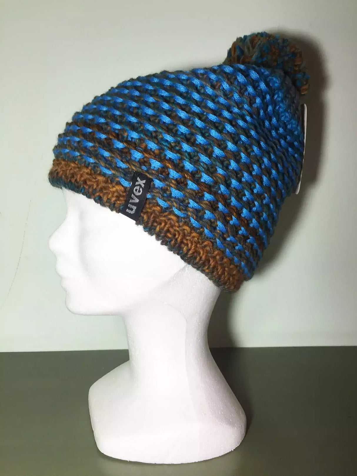 Cappello Lana Azzurro/ Marrone Con Pon Pon Interno In Pile Cod.uv18-7n190 Var 10 Uvex